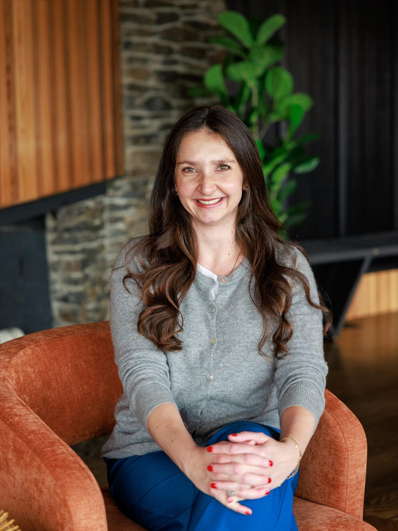 Alexandra Clouse seated in a living room