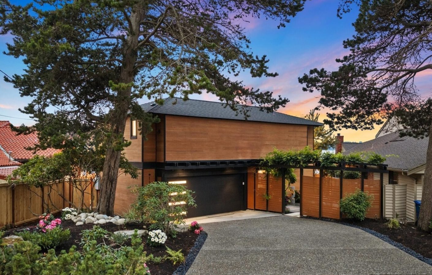 Modern cedar home at dusk in Arroyo Beach