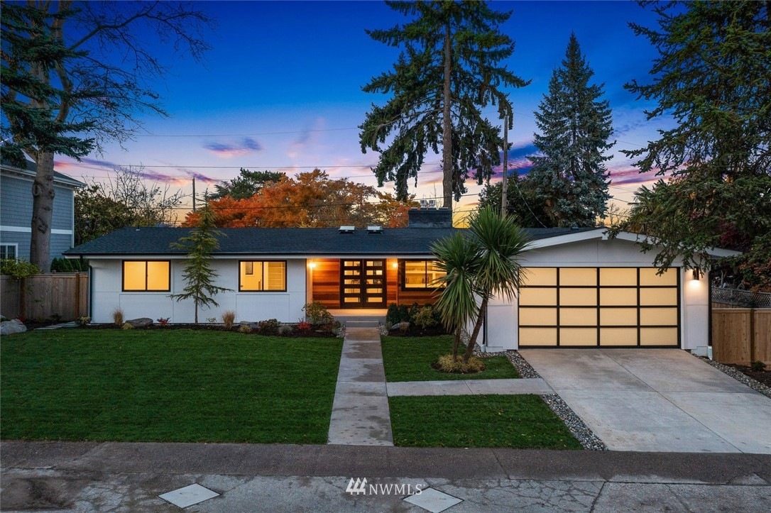 Mid-century modern home at dusk in Madison Park