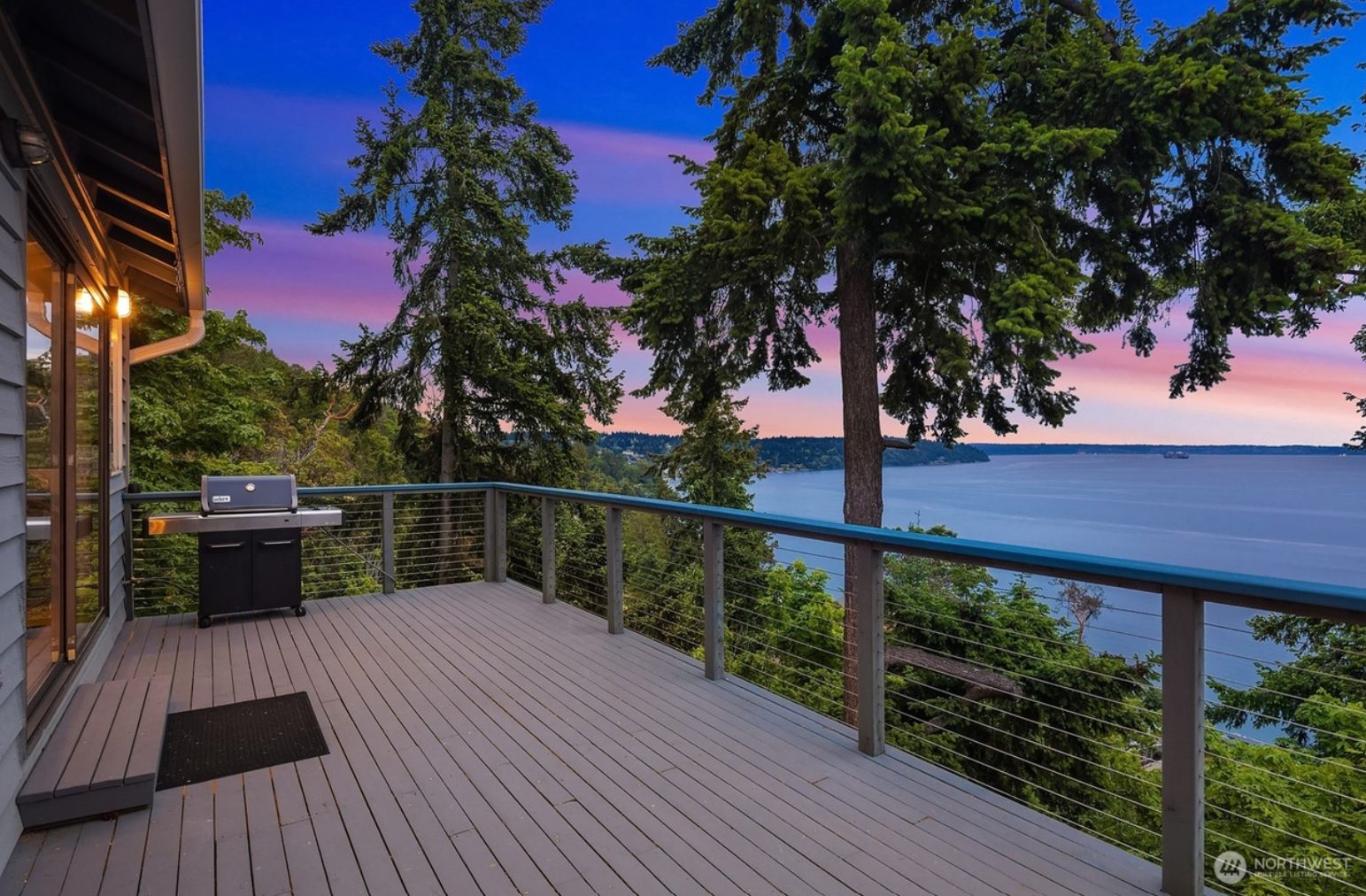 Deck at dusk overlooking Puget Sound at Three Tree Point
